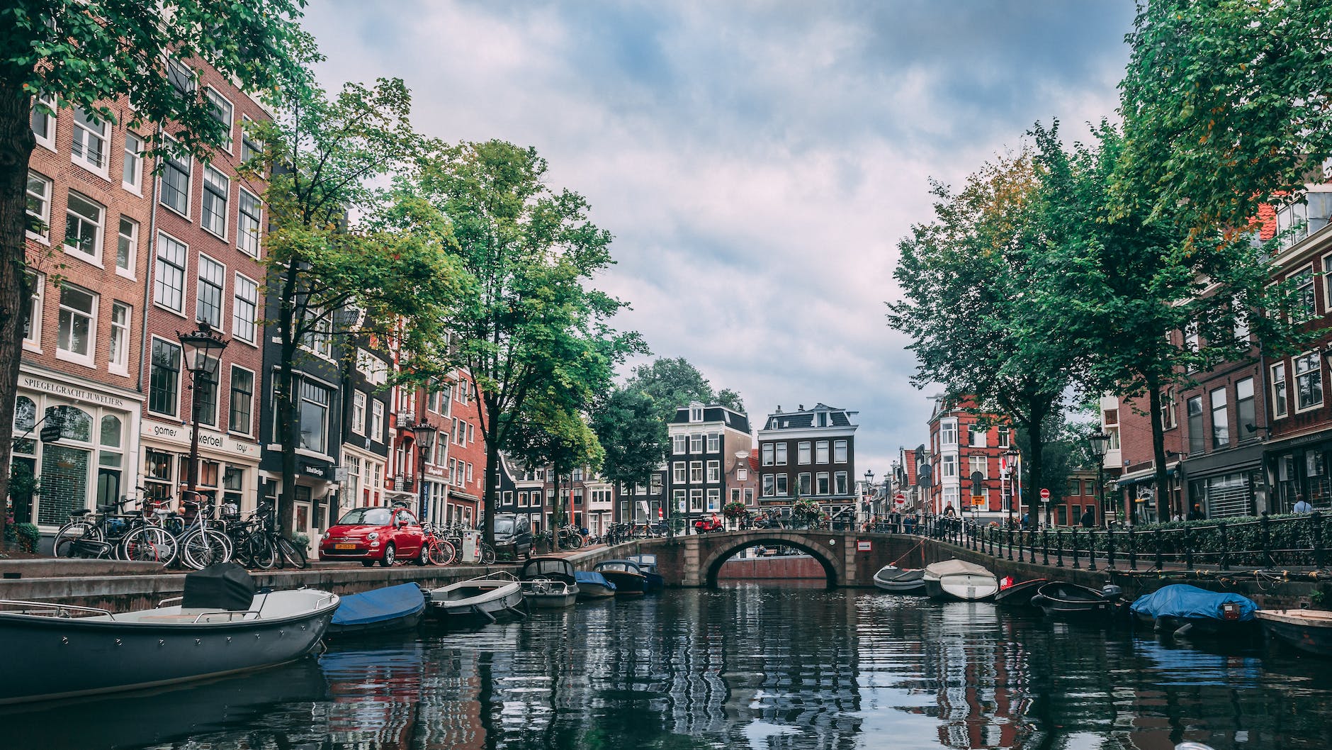 photo of boats parked on river